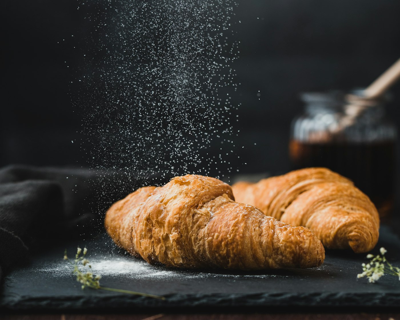Daytime pastry plate beside coffee
